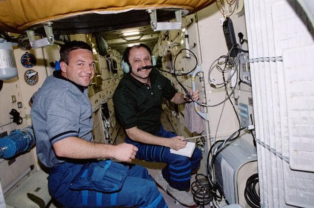 NASA image: Usachev and Lonchakov use the HAM radio in Zarya during STS-100