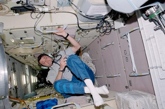 NASA image: Pilot Ashby uses the HAM radio in Zarya during STS-100