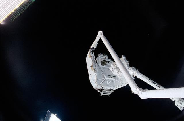 NASA image: View of the "handshake" between Endeavour's RMS and the SSRMS during STS-100