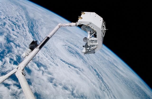 NASA image: View of the "handshake" between Endeavour's RMS and the SSRMS during STS-100