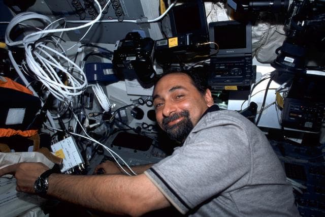 NASA image: MS Guidoni at work on the flight deck of Endeavour during STS-100