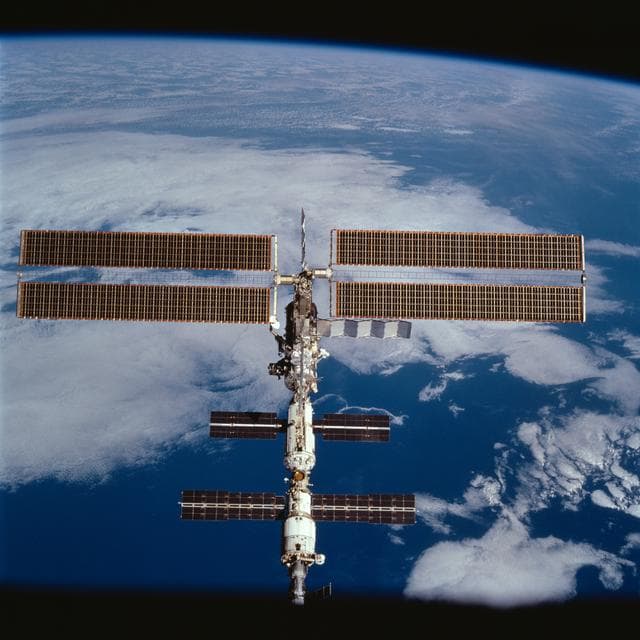 NASA image: Zenith view of the ISS taken during the final flyaround of the STS-100 mission