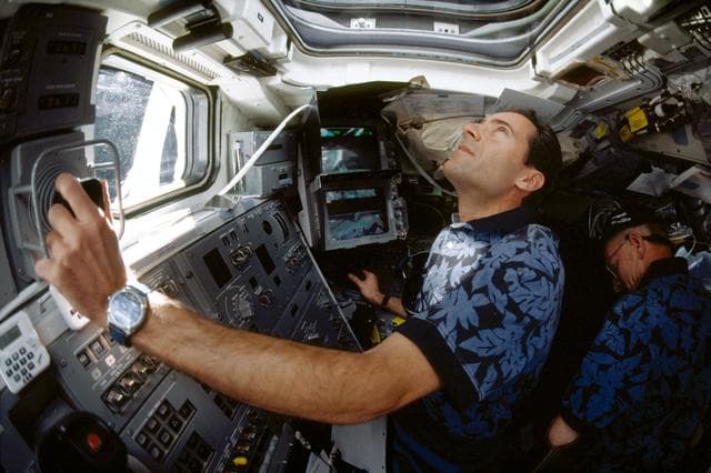 NASA image: Various view with fish-eye lens of STS-103 crew on aft flight deck
