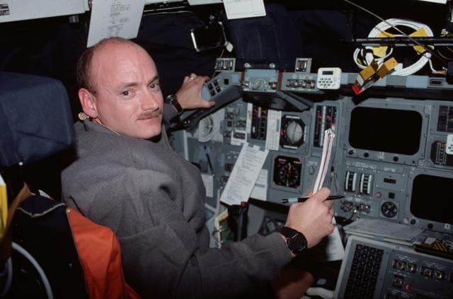 NASA image: Various views of the STS-103 crew on the flight deck
