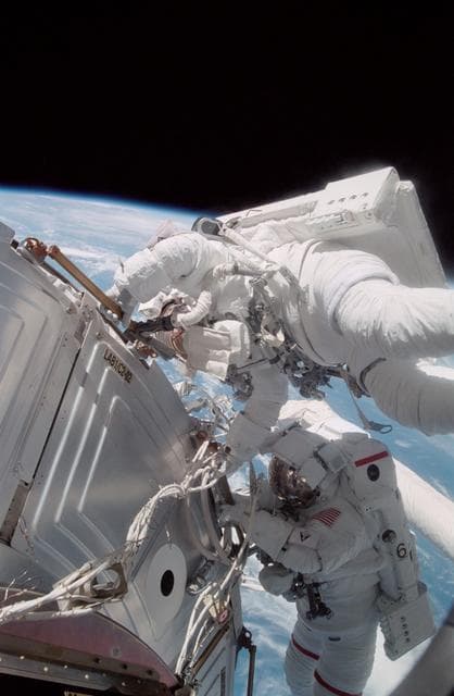 NASA image: Forrester working with S0 cables on the LAB during EVA2