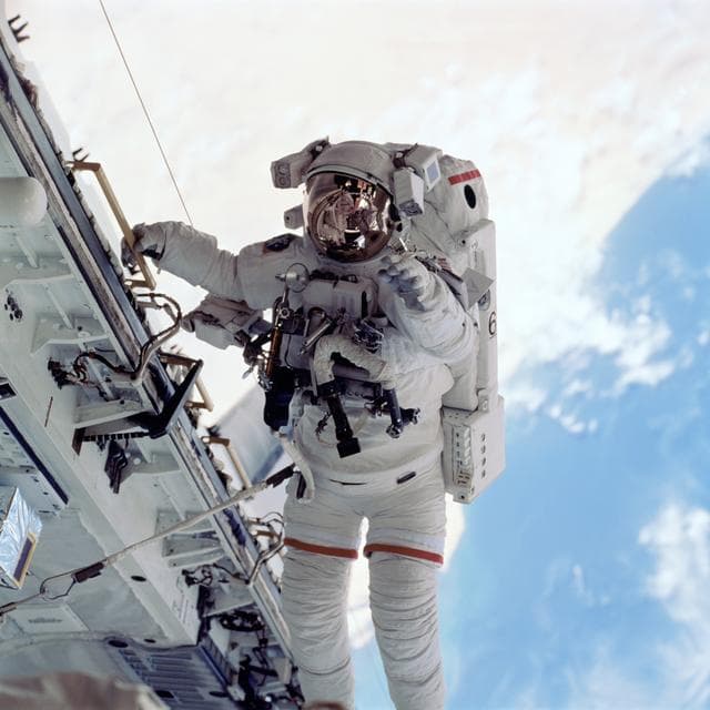 NASA image: Barry translates along orbiter sill during EVA