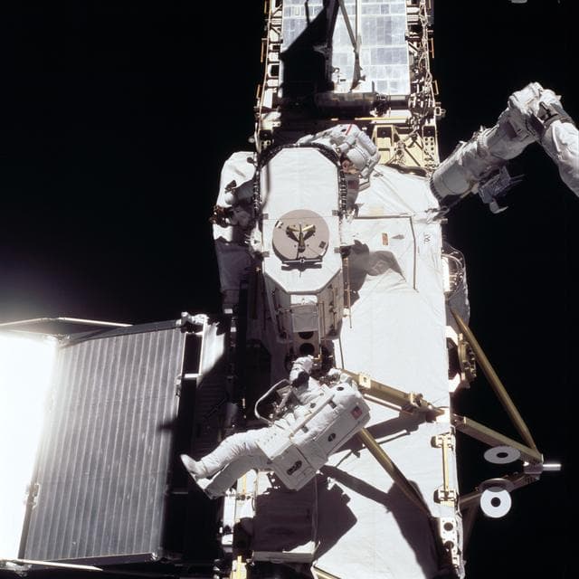 NASA image: Forrester mates EAS capture bell onto ISS P6 trunnion during EVA