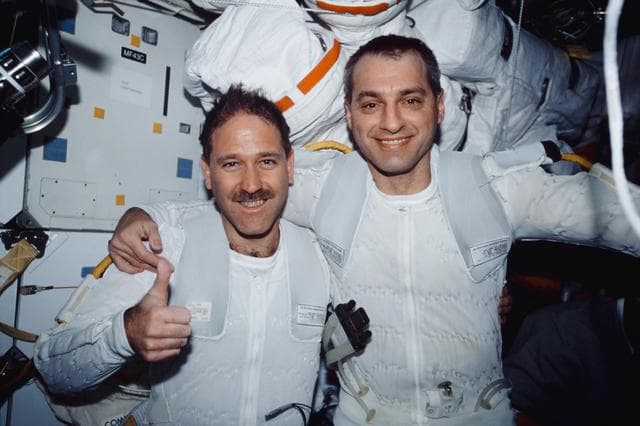 NASA image: MS Grunsfeld and Linnehan on middeck after EVA 1