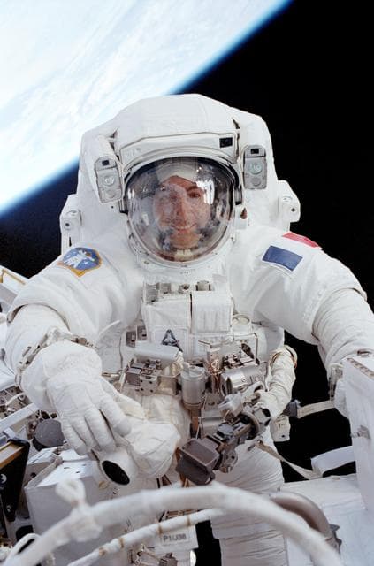NASA image: Perrin smiles through the visor of his EVA helmet while working beside the MBS during STS-111 EVA 2