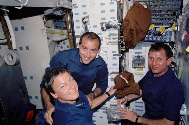 NASA image: Whitson, Perrin, and Treschev by the galley on Endeavour's MDK during STS-111 UF-2