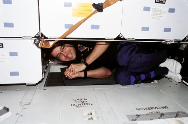 NASA image: Bursch is 'stowed' in an open double locker location on Endeavour's MDK during STS-111 UF-2