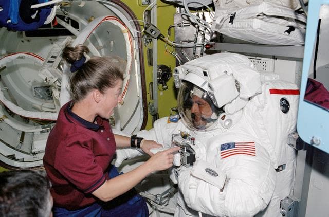 STS-112  PLT Melroy and MS Wolf in Quest airlock prior to EVA 2