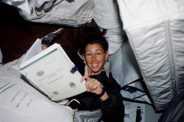 NASA image: MS Magnus on middeck with stowage bags
