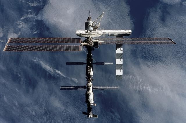 NASA image: View of the zenith aft side of the ISS taken during STS-112's flyaround
