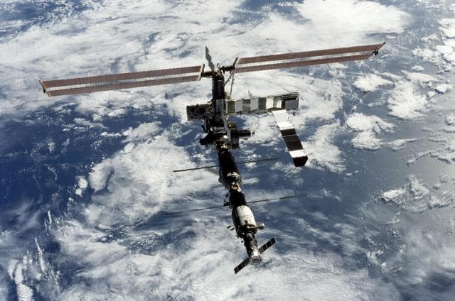 NASA image: View of the zenith aft side of the ISS taken during STS-112's flyaround