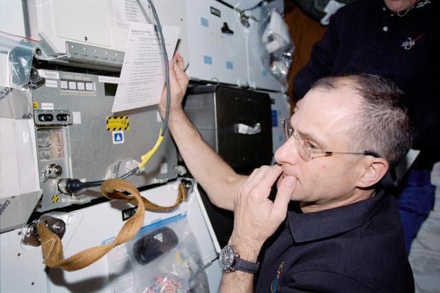 NASA image: Pettit works with PCG-STES on Endeavour's MDK during STS-113