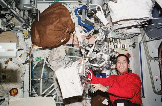 NASA image: Herrington works with EVA tools / toolbox in the U.S. Lab during STS-113