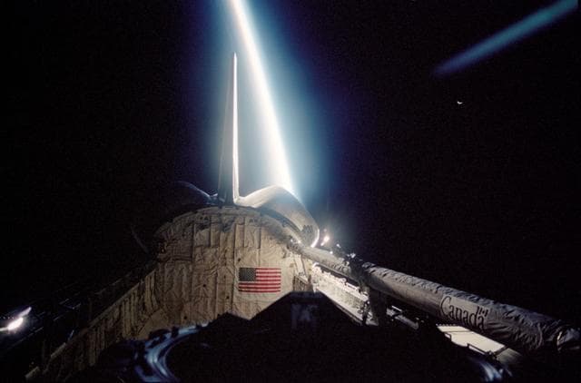 NASA image: Orbiter Endeavour's PLB backdropped by illuminated edge of Earth's limb during STS-113