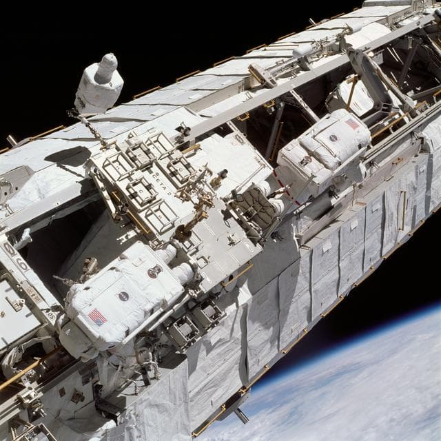NASA image: Lopez-Alegria and Herrington test foot restraints on CETA cart 2 during STS-113 EVA OPS
