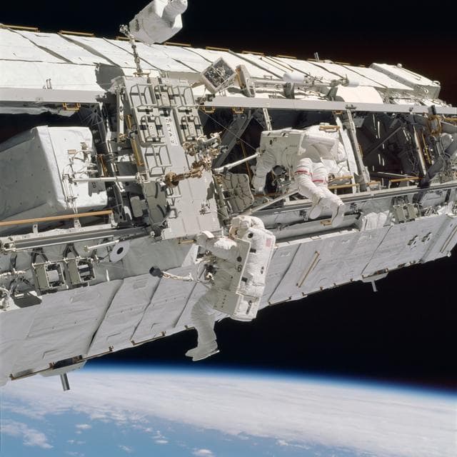 NASA image: Lopez-Alegria and Herrington work near CETA cart 2 during STS-113 EVA OPS