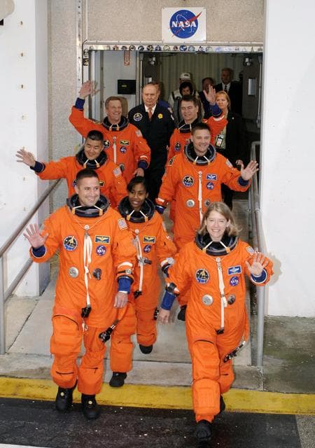 NASA image: STS-120 crew leaves the Operations and Checkout bldg at KSC