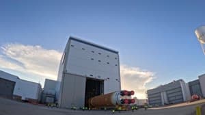 NASA image: Core Stage for Artemis II Rocket Moved to Pegasus Barge for Departure to Kennedy Space Center